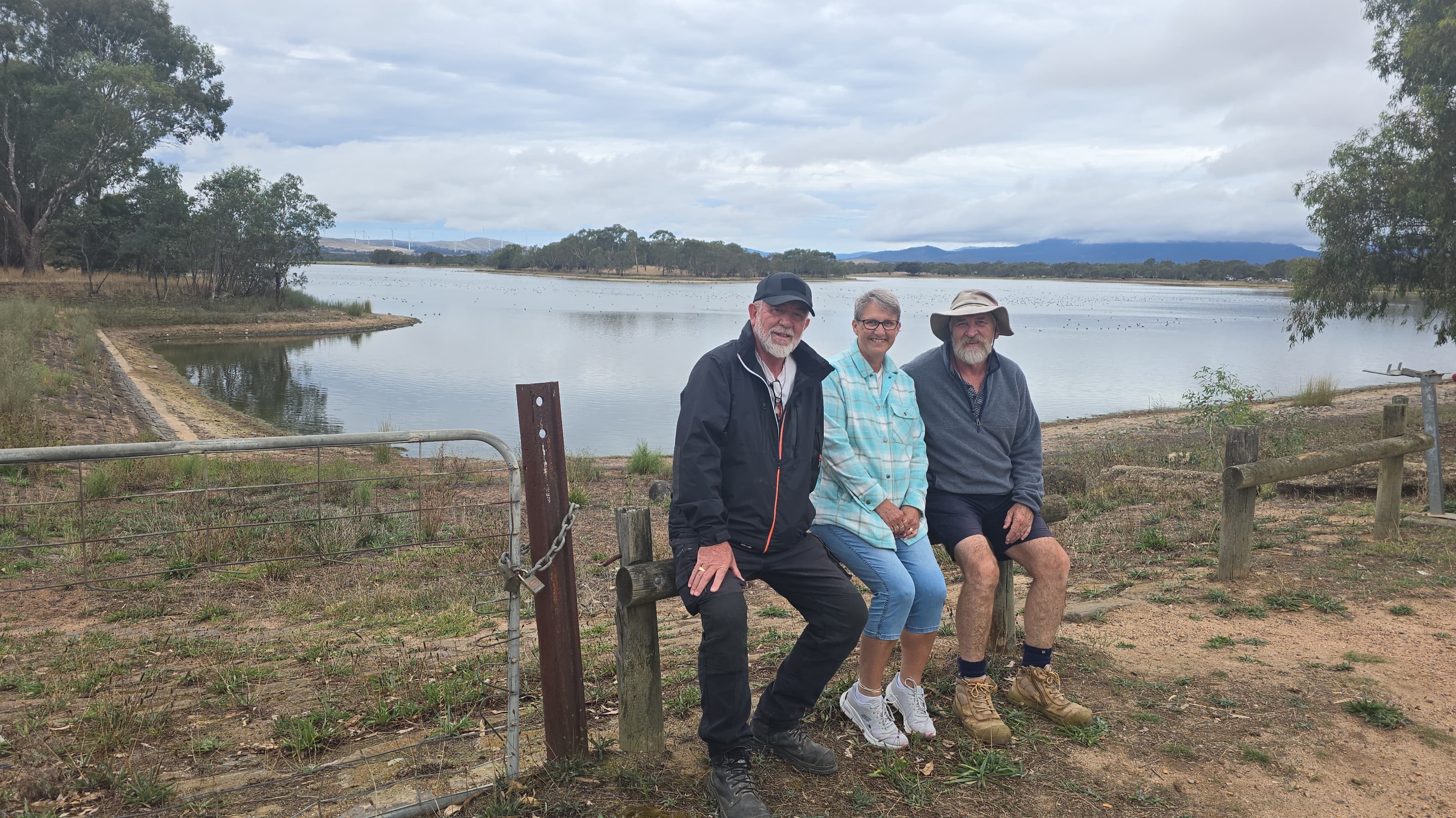 Karen and friends sitting by the lake