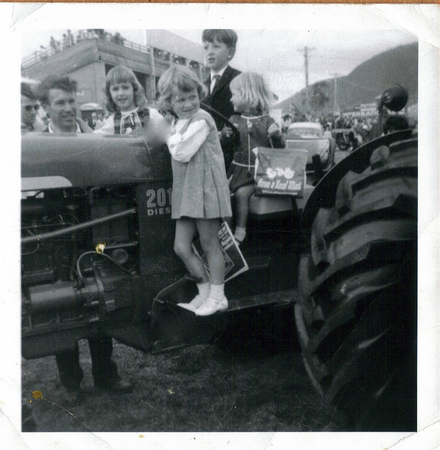 An old black-and-white family photo at a parade